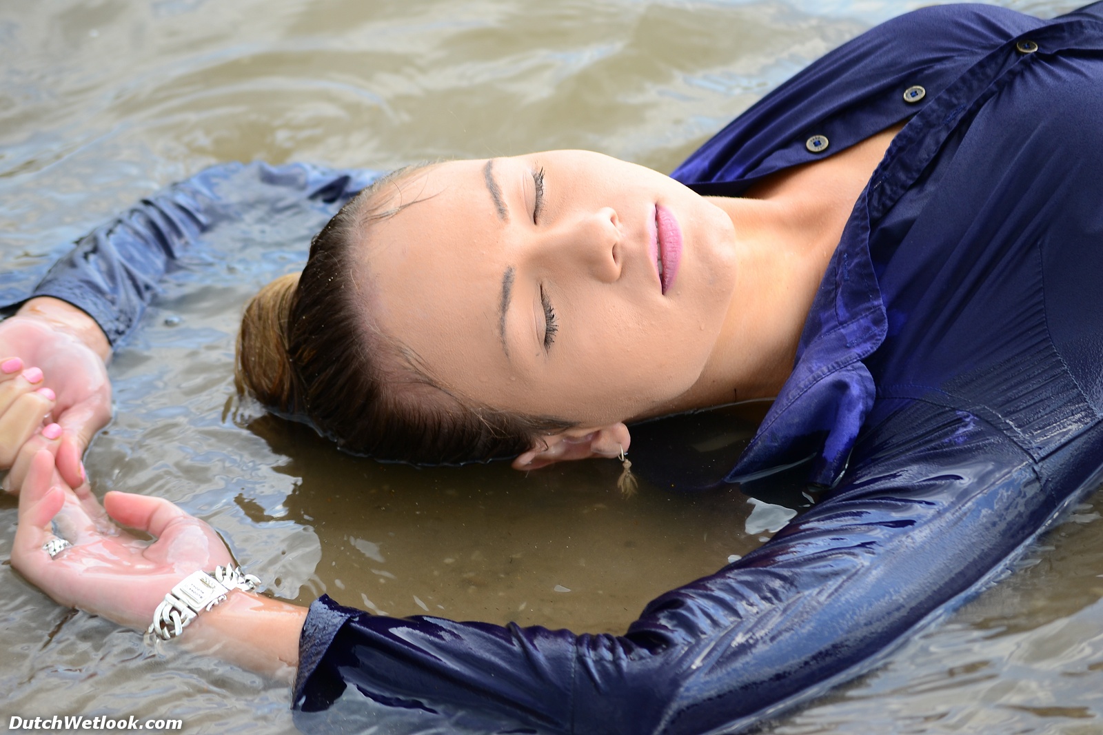 There is clothed swimming, but also posing in wet clothing. 